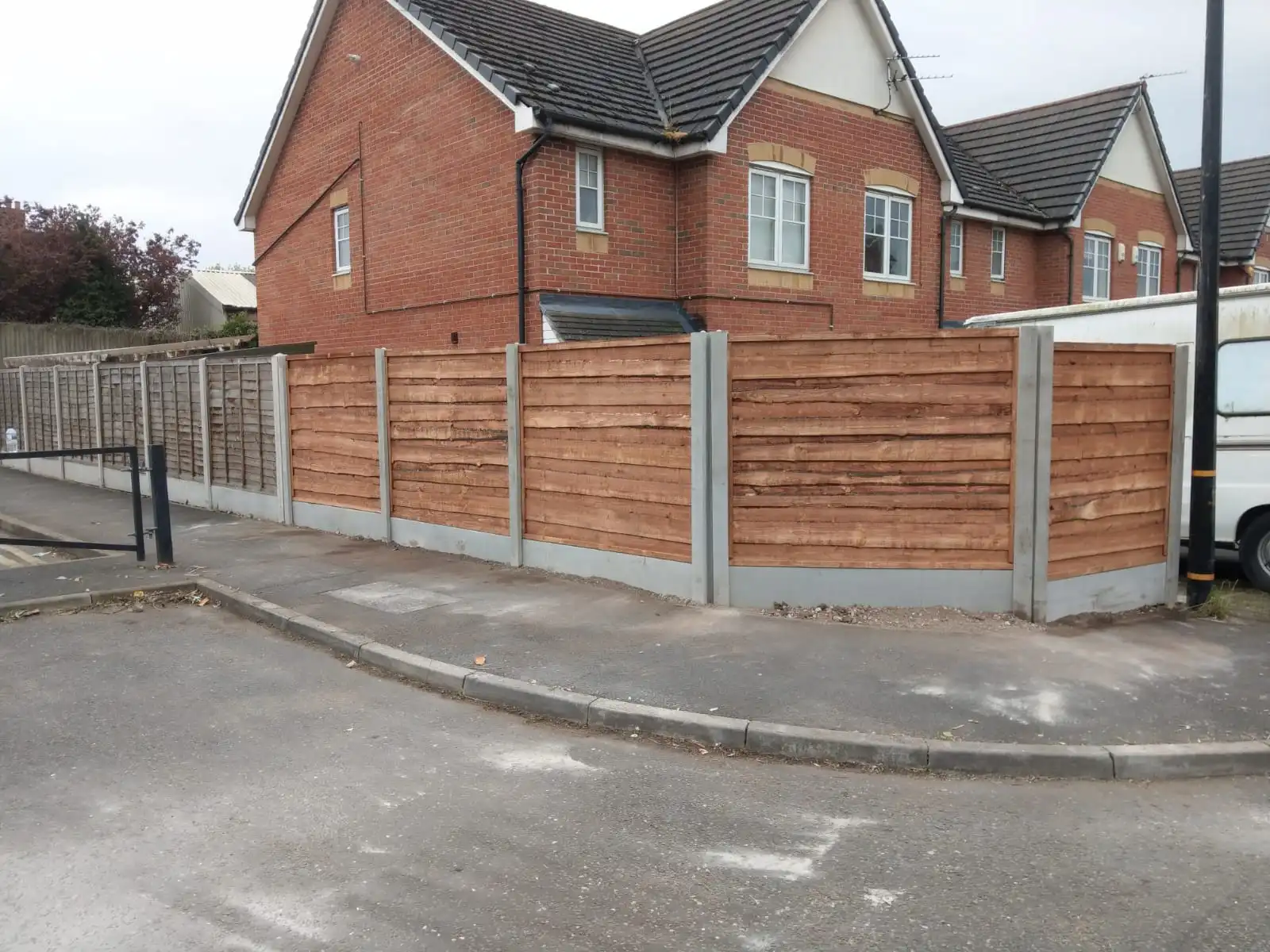 Horizontal panel fencing with concrete posts in Altrincham residential property
